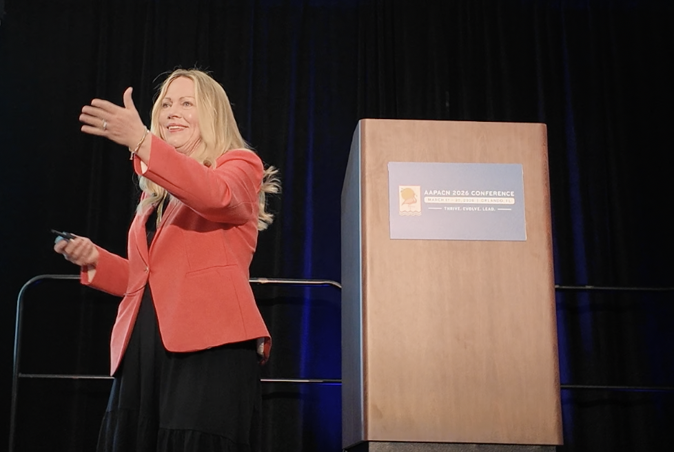 Kim Watson speaking on stage